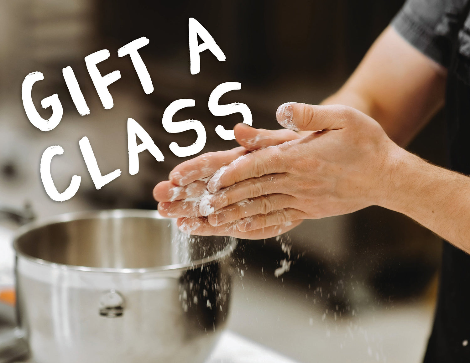 Person with flour-dusted hands near a mixing bowl, with text 'Gift a Class' overlayed.
