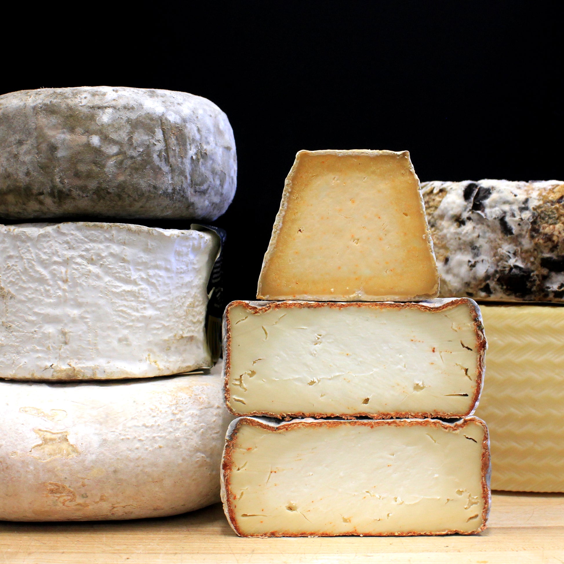 Cheeses stacked on top of one another