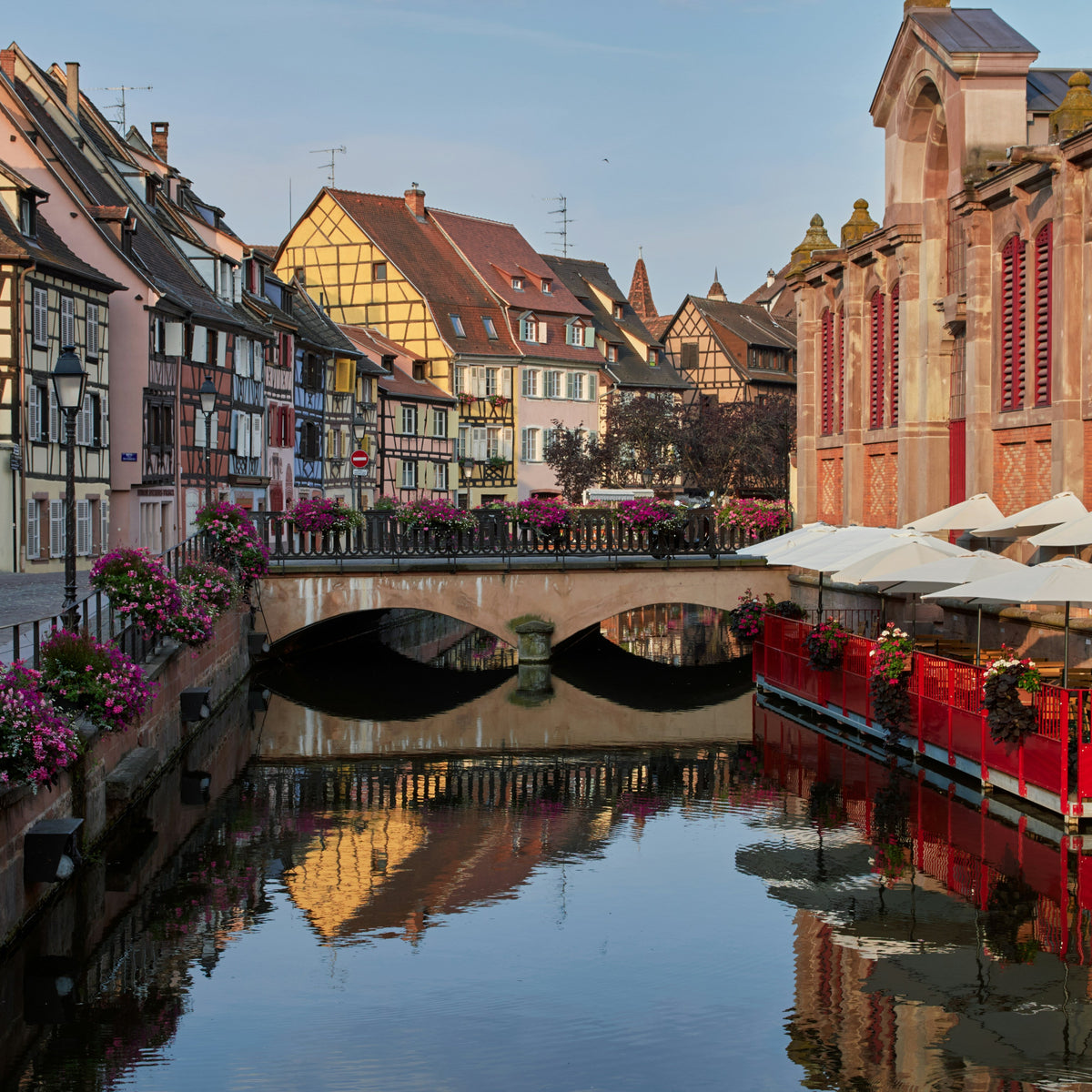 Canal with boats and colorful buildings in a European town