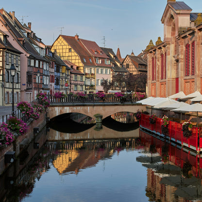 Canal with boats and colorful buildings in a European town
